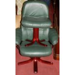 A contemporary beech framed and green leather upholstered swivel armchair;