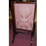 A 19th century mahogany floral silk inset fire screen,