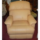 A contemporary mustard leather upholstered reclining Lazyboy armchair