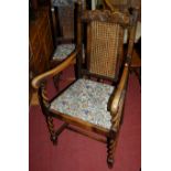 A set of six early 20th century oak and cane inset dining chairs,