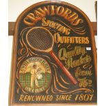A reproduction painted wooden sign for Crawfords Sporting Outfitters