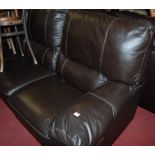 A contemporary dark brown leather three seater sofa,