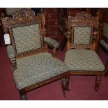 A good set of eight late 19th century heavily carved oak pad back and seat dining chairs,