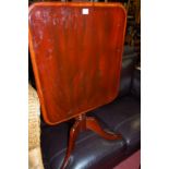 A Victorian mahogany round cornered tilt-top pedestal tripod table