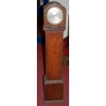 A 1930s beaded oak grandmother clock having striking and chiming movement
