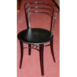 A set of four contemporary metal framed and black vinyl padseat cafe chairs