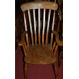 An early 20th century elm seat and beech slatback farmhouse kitchen elbow chair