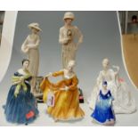 Four various porcelain figurines to include; Royal Doulton and Coalport;