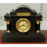 A Circa 1900 slate mantel clock with eight day French brass cylinder movement striking on a gong