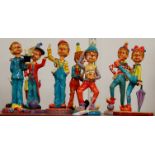 A set of eight reproduction painted composition clown figures