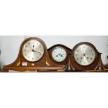 An oak cased mantel clock with striking movement;