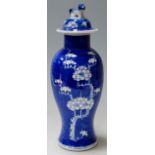 A Chinese export blue and white vase and cover (restored to neck)