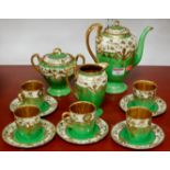 A Japanese eggshell five place setting coffee set with gilt decoration