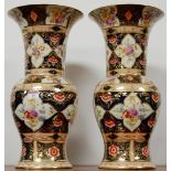 A pair of 19th century soft-paste porcelain vases, in the Derby style, each decorated with sprays of