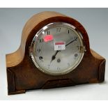 An early 20th century oak cased striking and chiming mantel clock