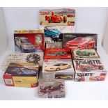12 mixed scale car, motorcycle and engine plastic kits,