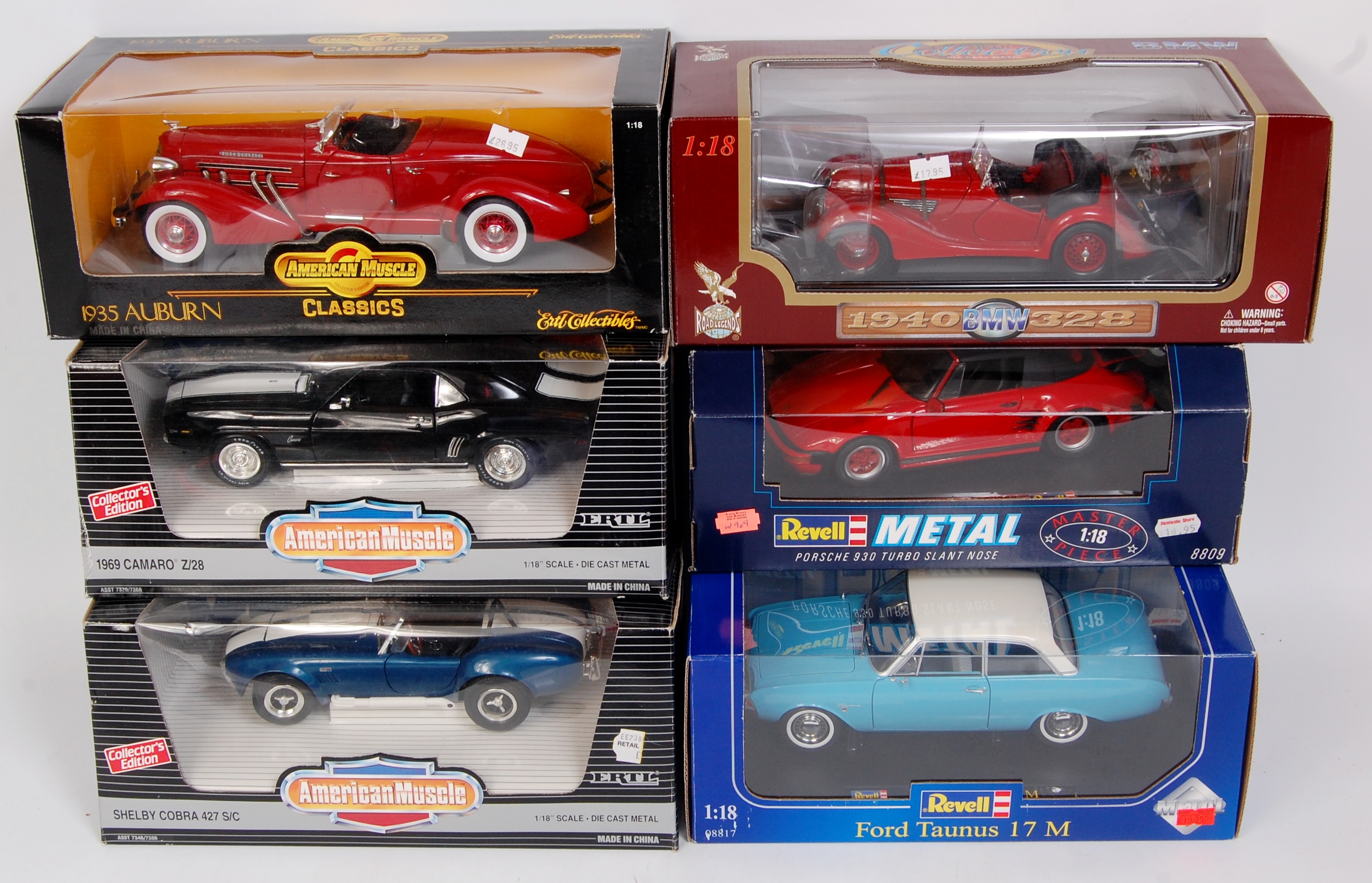 12 Boxed 1/18th scale diecast vehicles by Burago, Revell, American Muscle and Minichamps,