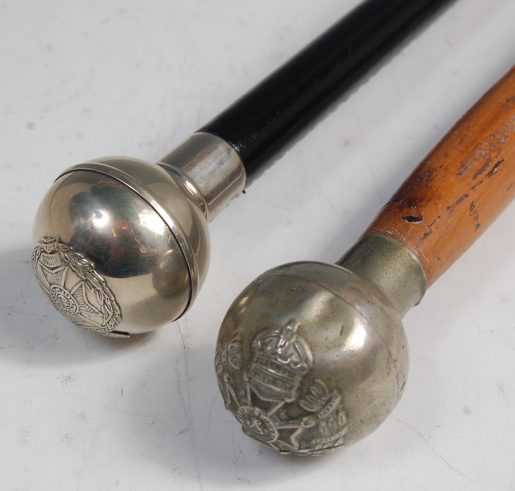 A Royal Green Jackets swagger stick having a leather covered shaft and plated terminal with