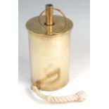 A large brass shell case,