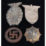 A 1931 SA Treffen Braunschweig badge, together with three other German badges.