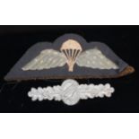 A British Army Parachute Regiment badge, together with a German Luftwaffe badge.