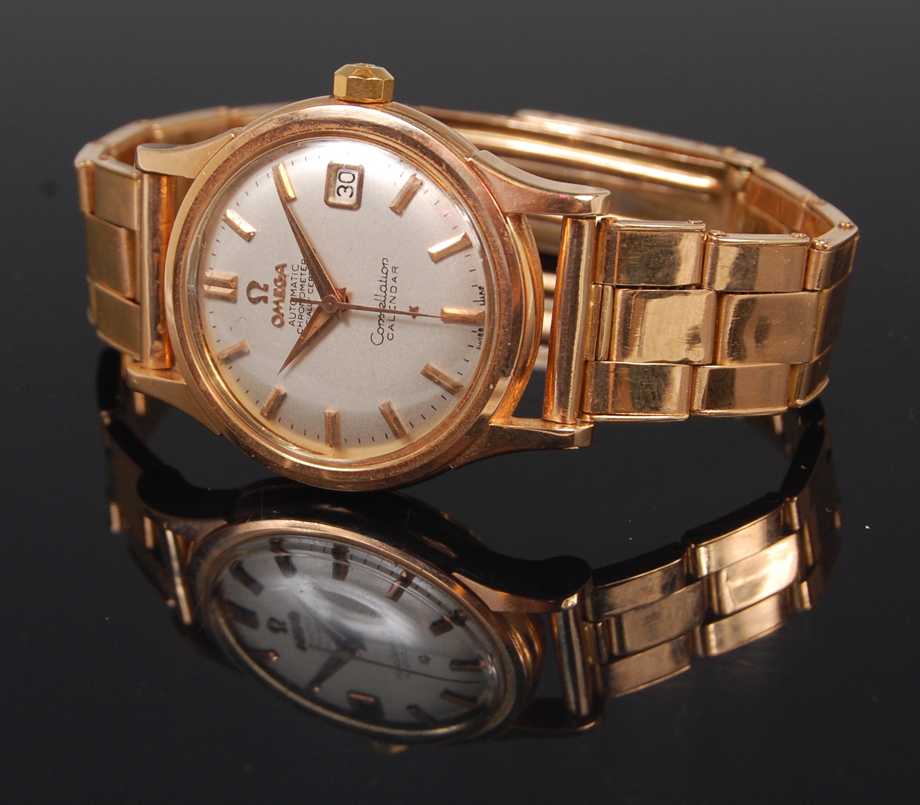 A gents 18ct rose gold Omega Constellation chronometer bracelet watch, having signed champagne