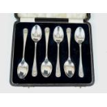 A cased set of six George V silver shell pattern coffee spoons, T B & S, Sheffield, 1913