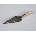 A Victorian silver novelty page marker in the form of a trowel, having mother of pearl handle,