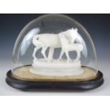 A Victorian carved white marble sculpture of a horse and foal, on ebonized platform base under a
