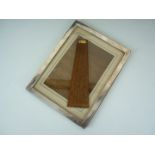 A silver-faced photograph frame, of rectangular planar form with easel back, Birmingham, 1923, 24 cm