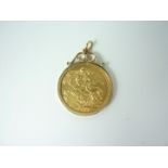 A 1911 gold sovereign in a 9ct gold pendant mount