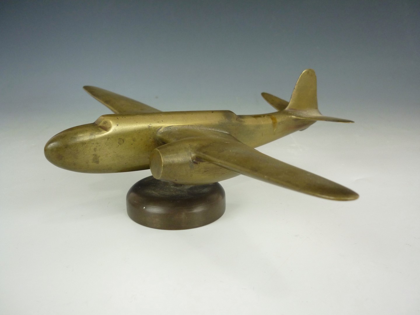 A Second World War period brass stylized model of a two-engined bomber