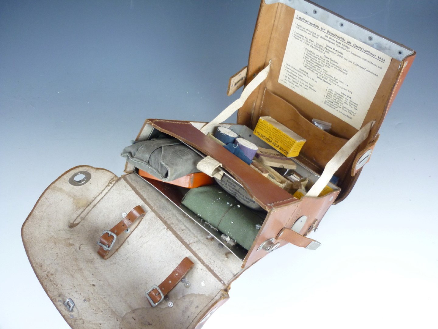 A Second World War German army medic’s leather field pack and contents - Image 2 of 2