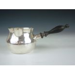 A 20th Century sterling silver brandy pan, of conventional bulbus form with turned laburnum side