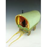 A sophisticated hand built model gypsy caravan, of traditional construction with fully fitted