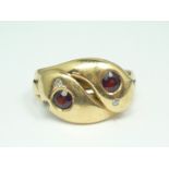 An 18ct gold, diamond and garnet dress ring, in the form of a pair of entwined serpents, each having