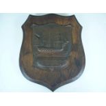 A Trafalgar centenary copper and oak plaque depicting HMS Victory and made from copper from the