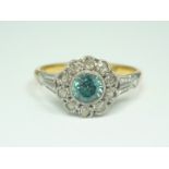 An early 20th Century 18ct gold, diamond and aquamarine dress ring, in a flowerhead arrangement