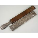 A Victorian silver cased razor strop, profusely chased and engraved with songbirds, foliage and