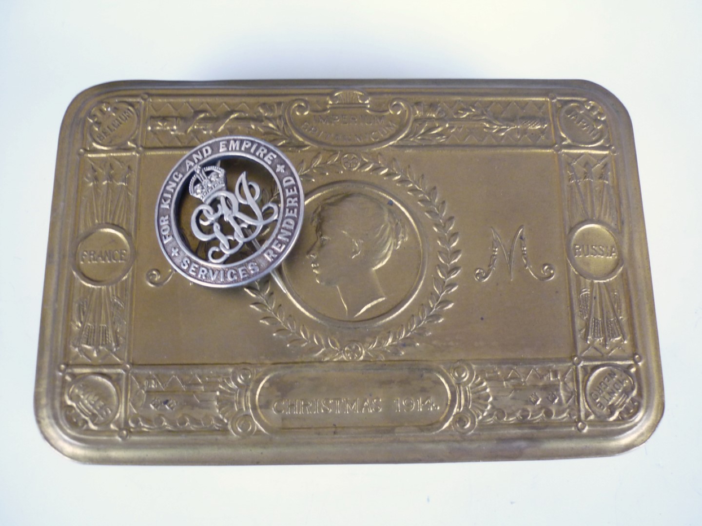 A 1914 Princess Mary gift tin and a Silver War Badge number 379887