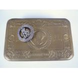 A 1914 Princess Mary gift tin and a Silver War Badge number 379887