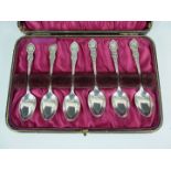 A cased set of George V silver tea spoons, with fancy stems and terminals, J H P, Sheffield, 1910,