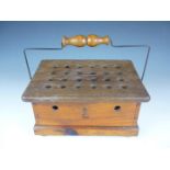 A Victorian carriage wooden portable foot warmer, of oblong shape with turned swing handle, the