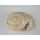 An Edo / Meiji Japanese carved ivory katabori netsuke modelled as a snail, character marks