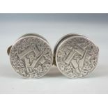 A pair of late 19th Century Masonic patent 'solitaire' cuff links, having engraved white metal faces