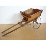 A Victorian wooden dog cart or tradesman's model tip cart, of sophisticated construction with spoked