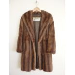 A mid 20th Century Fenwick's Department Store 'French Salon' fox fur coat, having rolled collar