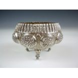 A late 19th / early 20th Century Indian white metal bowl, of circular section with inverted rim, the