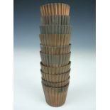 A set of eight 19th Century copper jelly moulds, each of reeded truncated conical form, and engraved