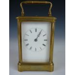 A late 19th / early 20th Century repeater carriage clock, in corniche case, 13 cm high excluding